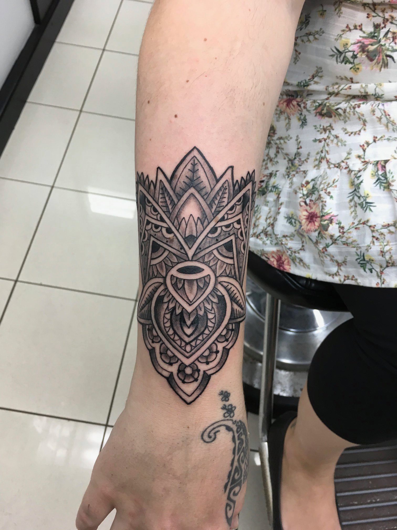 A Woman Has a Black and White Tattoo on Her Forearm — La Bomba Loca Tattoo in Cairns City, QLD