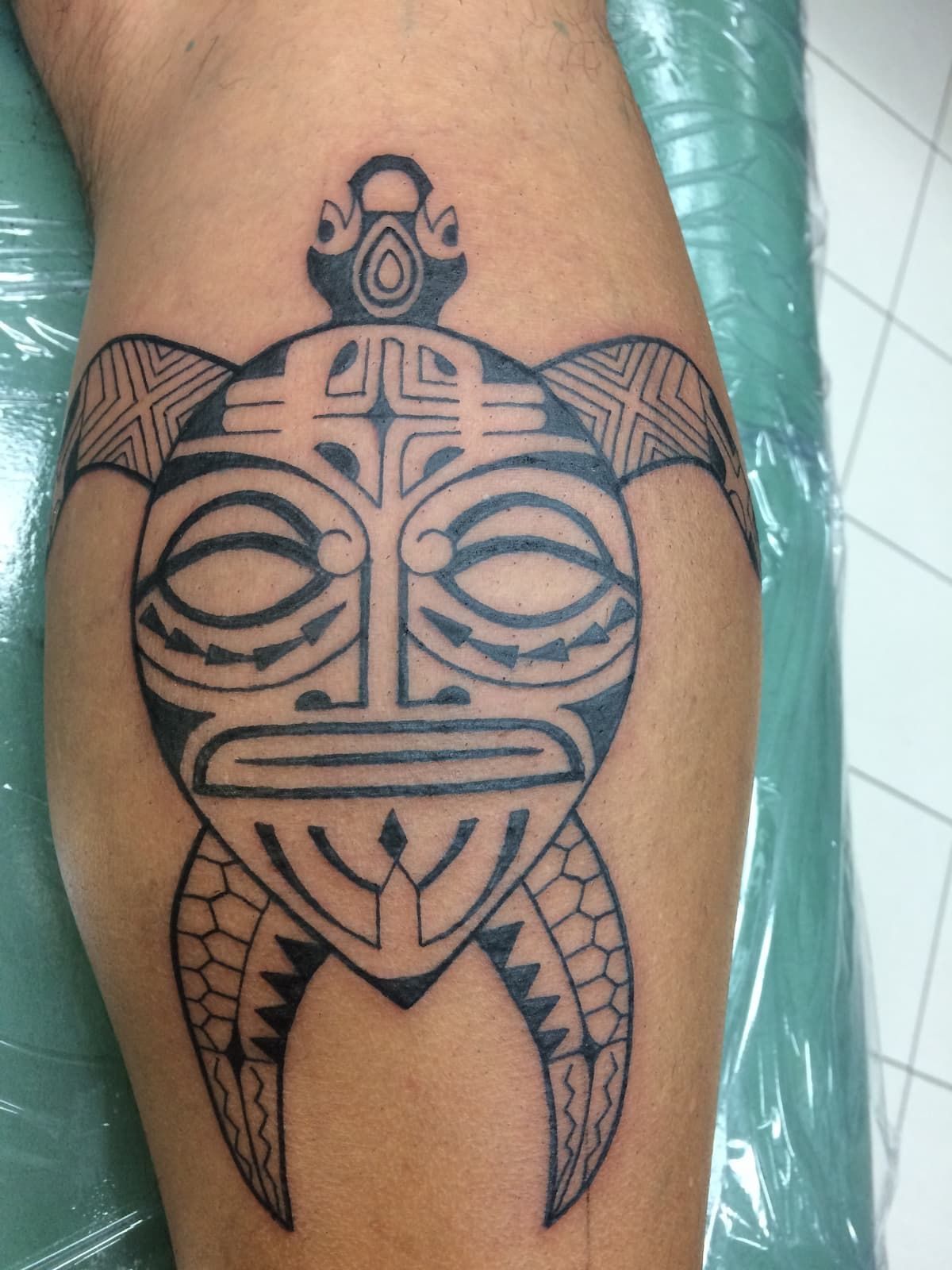 A Black and White Tattoo of a Turtle on a Person's Leg — La Bomba Loca Tattoo in Cairns City, QLD