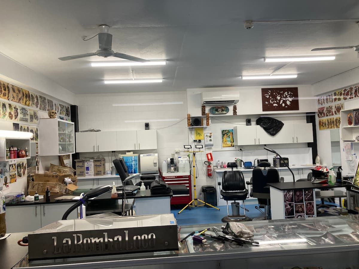 A Large Room With a Lot of Furniture and a Ceiling Fan — La Bomba Loca Tattoo in Cairns City, QLD