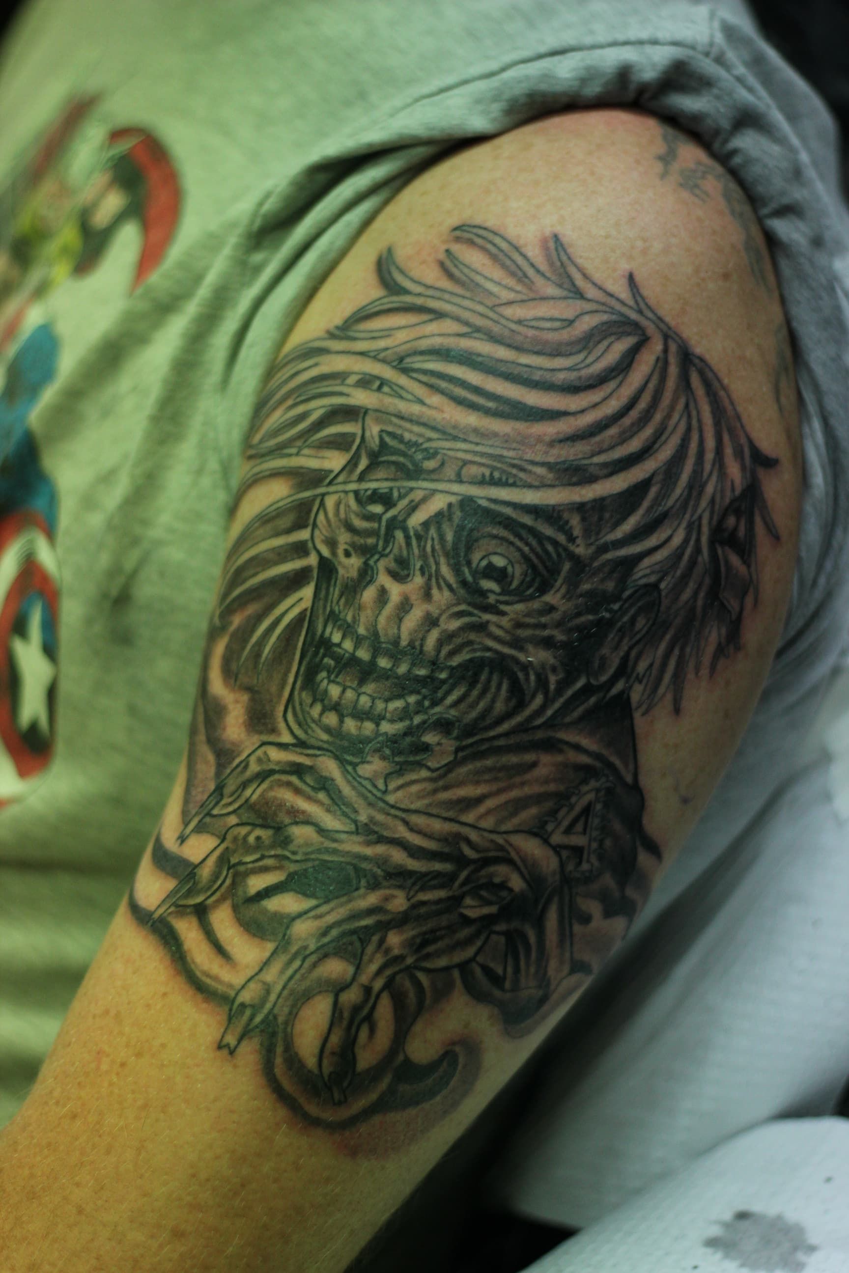 A Person Has a Tattoo on His Arm — La Bomba Loca Tattoo in Cairns City, QLD