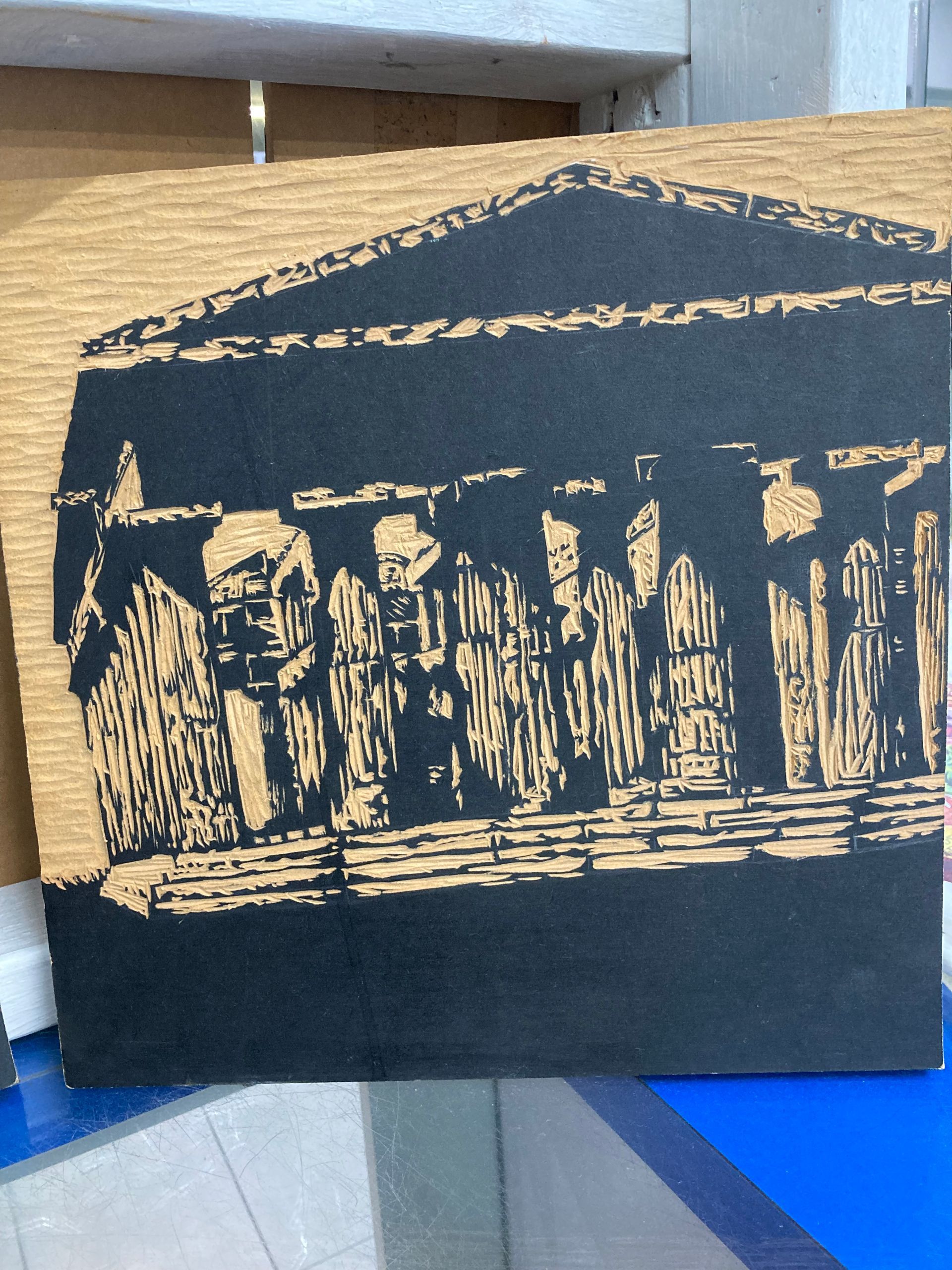 A Black and Gold Drawing of a Building on a Table — La Bomba Loca Tattoo in Cairns City, QLD