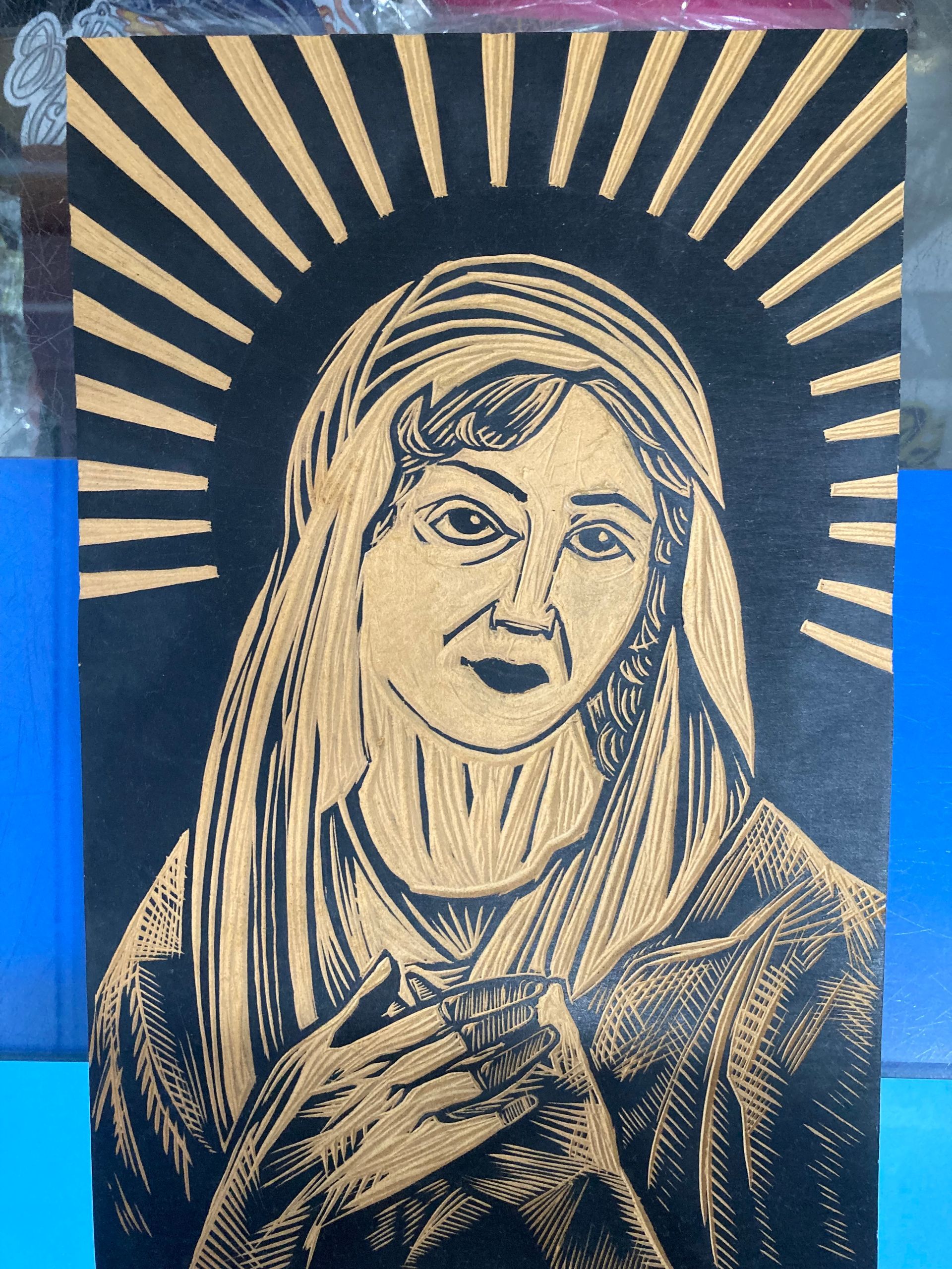 A Black and Gold Painting of a Woman With a Crown on Her Head — La Bomba Loca Tattoo in Cairns City, QLD