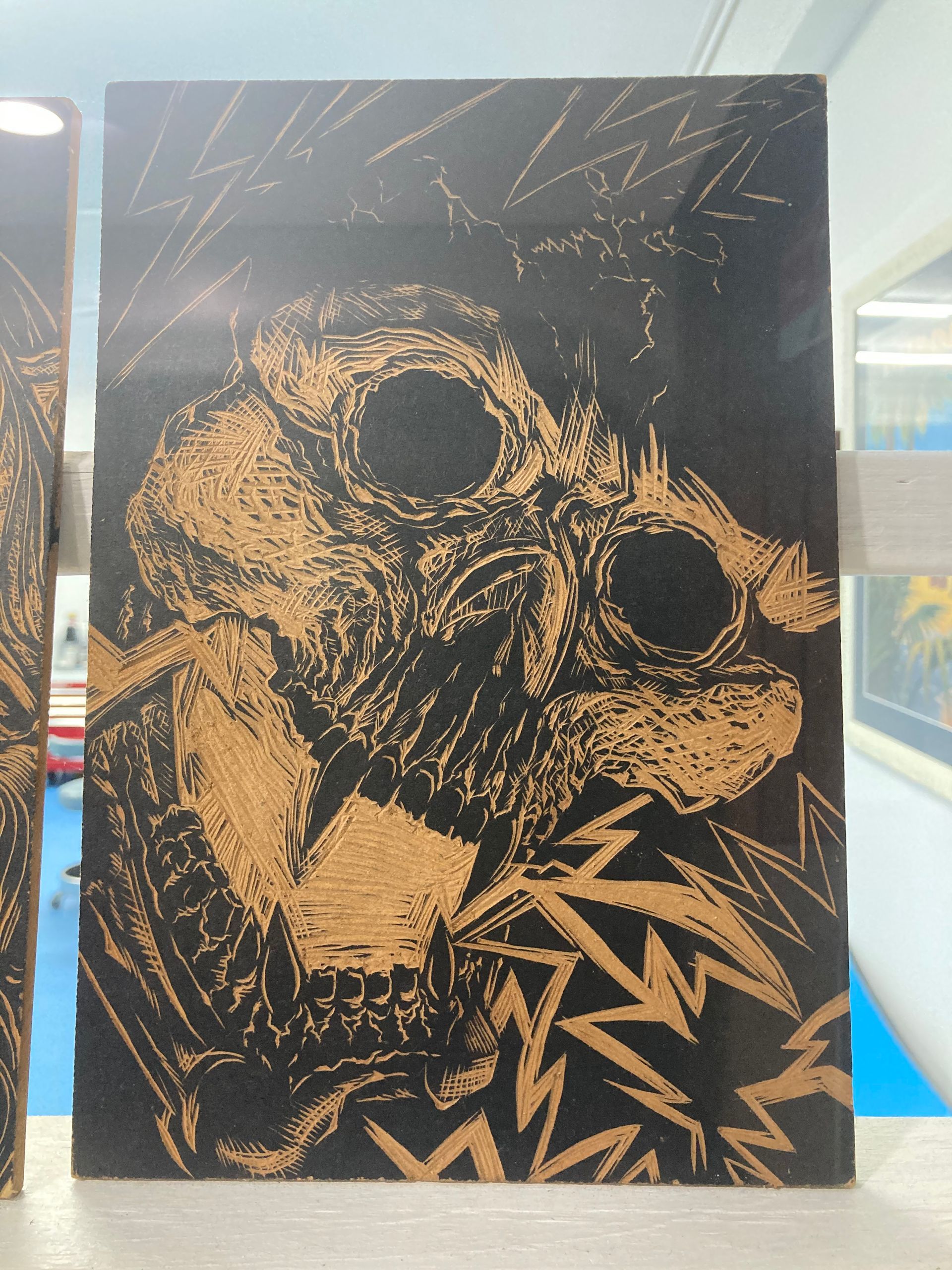 A Black and Gold Painting of a Bird With Big Eyes — La Bomba Loca Tattoo in Cairns City, QLD