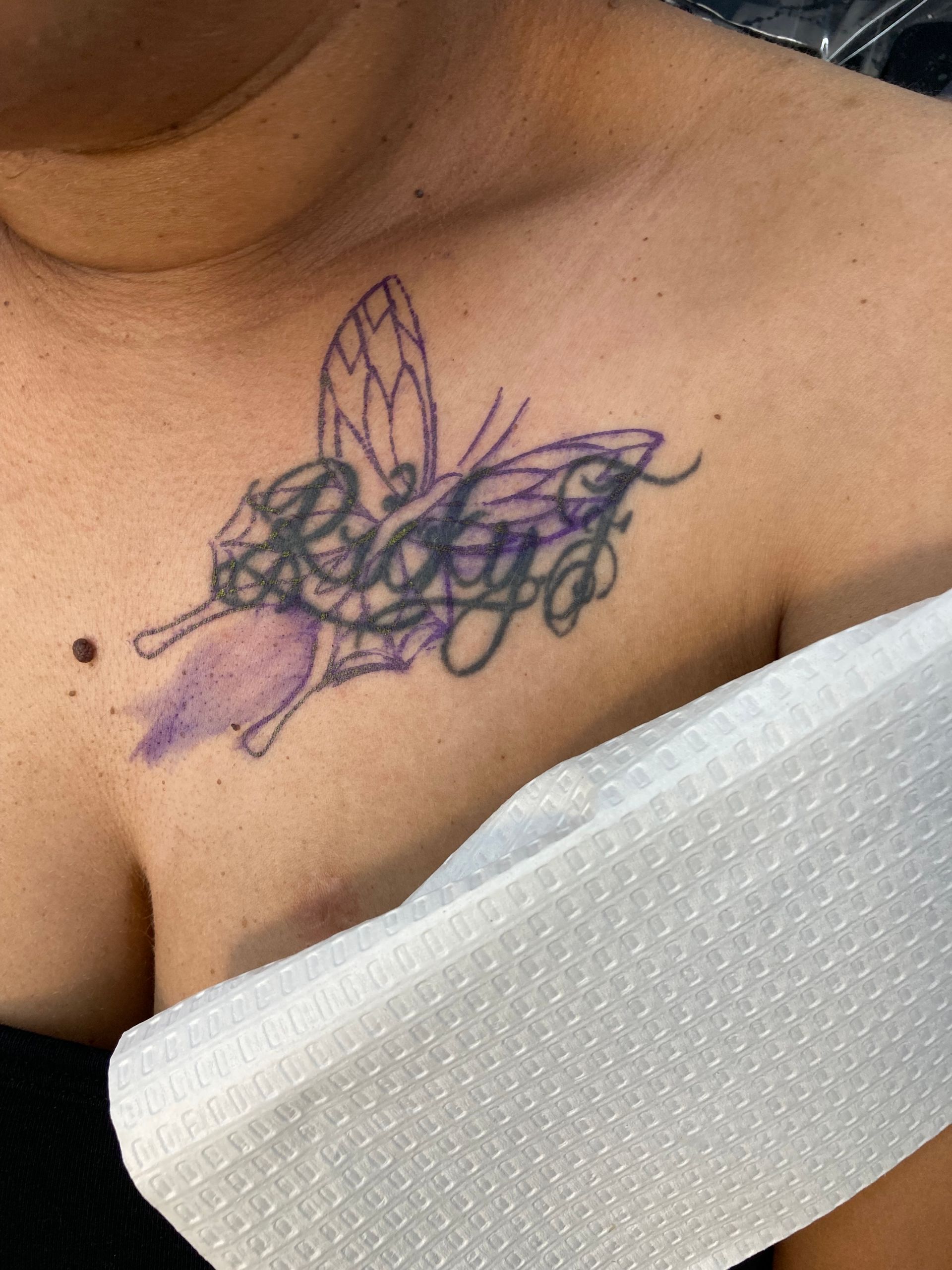 A Woman Has a Tattoo of a Butterfly — La Bomba Loca Tattoo in Cairns City, QLD