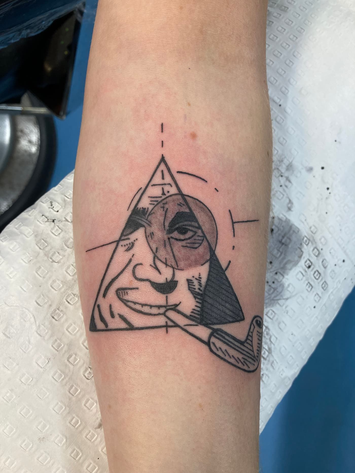 A Person Has a Tattoo of a Cross on Their Wrist — La Bomba Loca Tattoo in Cairns City, QLD