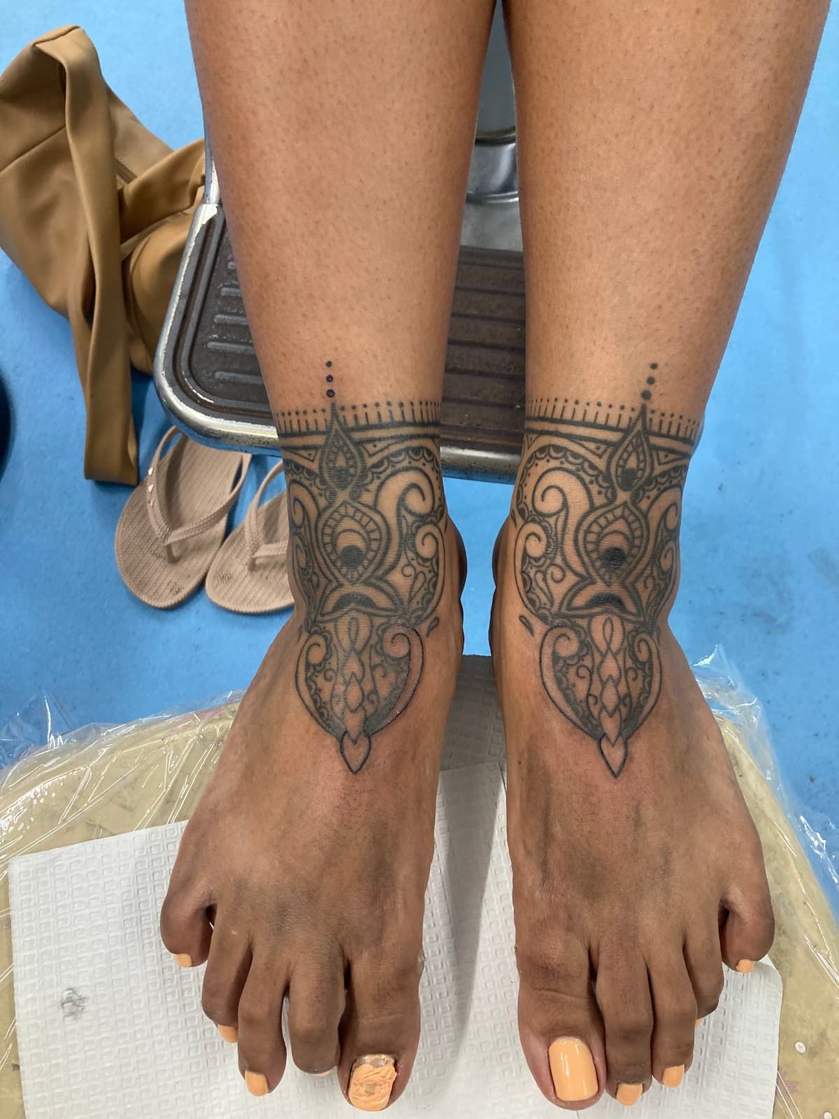 A Woman Has a Tattoo on Her Ankle and Foot — La Bomba Loca Tattoo in Cairns City, QLD