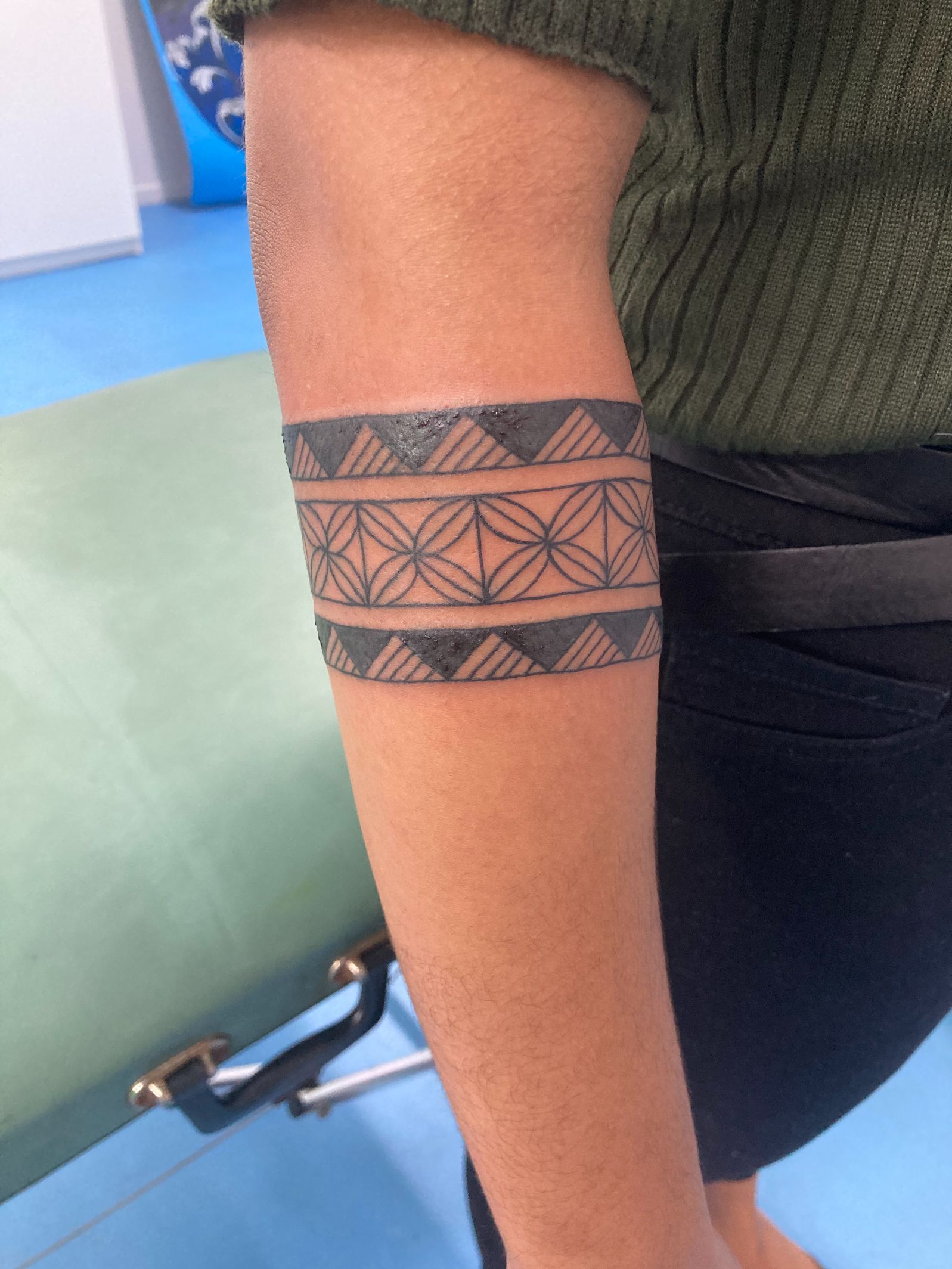 A Person Has a Tattoo on Their Arm That Looks Like a Bracelet — La Bomba Loca Tattoo in Cairns City, QLD