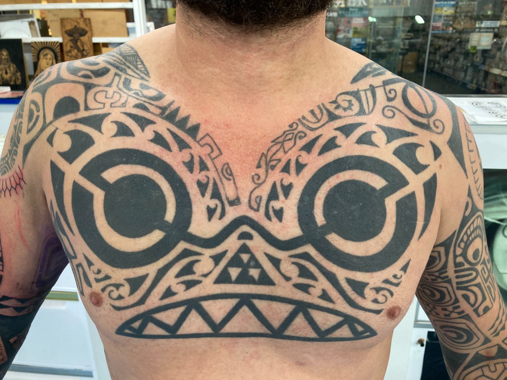 A Man Has a Large Tattoo on His Back — La Bomba Loca Tattoo in Cairns City, QLD