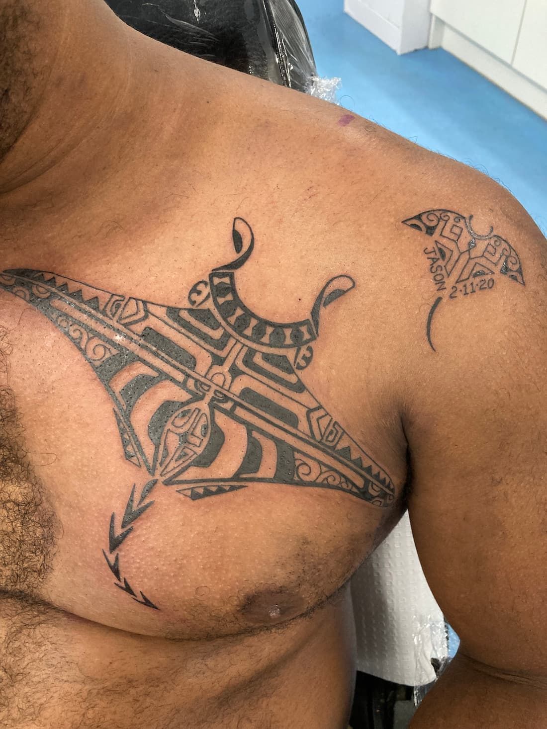 A Man Has a Tattoo of a Manta Ray on His Chest and Shoulder — La Bomba Loca Tattoo in Cairns City, QLD
