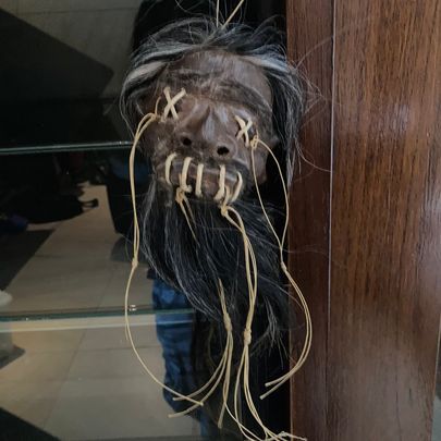 A Statue of a Man With a Beard is Hanging on a Wall — La Bomba Loca Tattoo in Cairns City, QLD