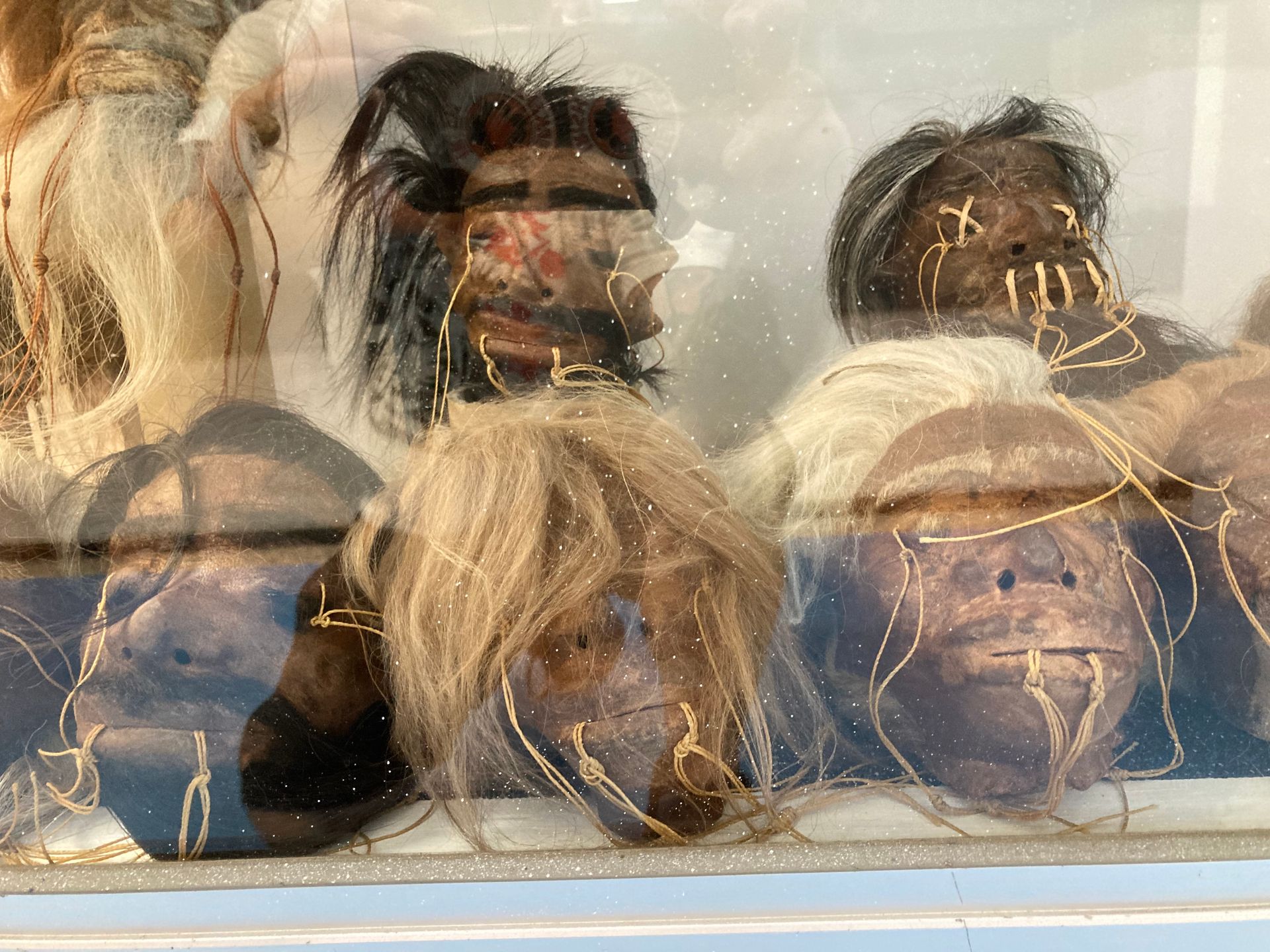 A Group of Heads Are Behind a Glass Display Case — La Bomba Loca Tattoo in Cairns City, QLD
