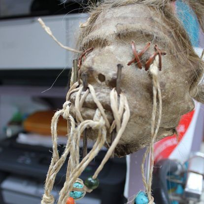 A Close Up of a Skull With Beads Hanging From It — La Bomba Loca Tattoo in Cairns City, QLD