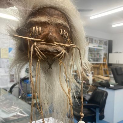 A Close Up of a Mask With a Needle Sticking Out of It — La Bomba Loca Tattoo in Cairns City, QLD