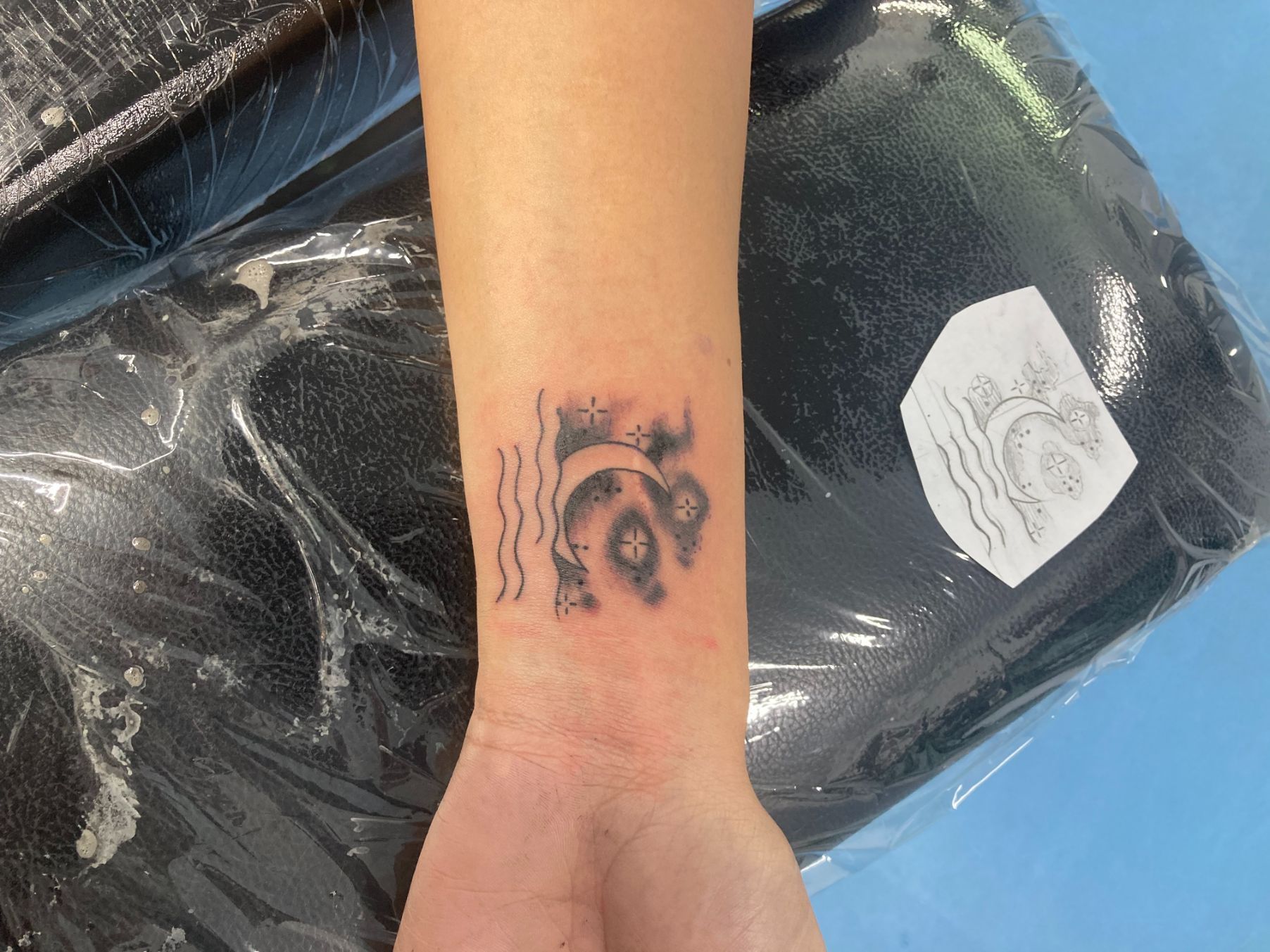 A Person Has a Tattoo on Their Wrist That Looks Like a Camera — La Bomba Loca Tattoo in Cairns City, QLD