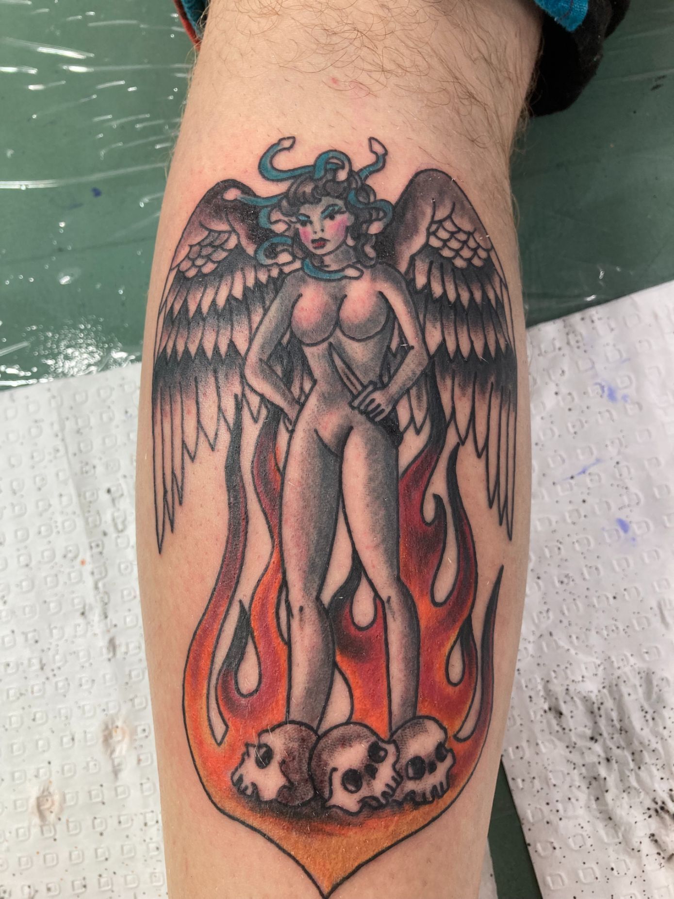 A Tattoo of a Woman With Horns and Wings Surrounded by Flames — La Bomba Loca Tattoo in Cairns City, QLD