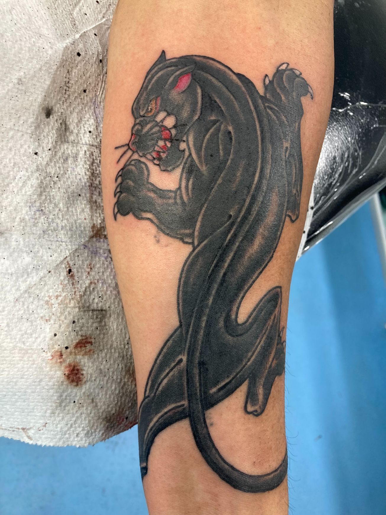 A Black Panther Tattoo on a Person 's Arm — La Bomba Loca Tattoo in Cairns City, QLD