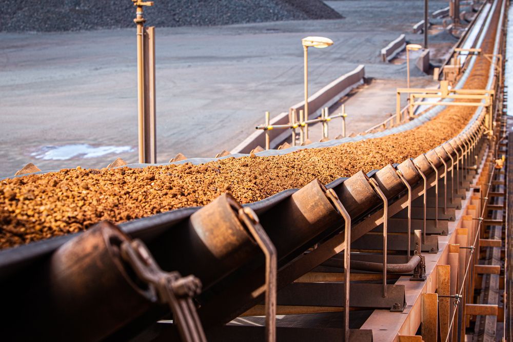 Iron Ore on Conveyor Belt — Effective Mining Construction in Townsville, QLD