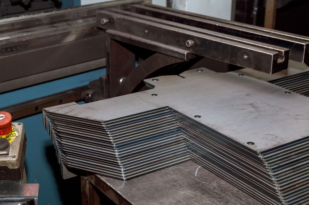 A Stack of Sheet Metal Products After Processing on a Bending Machine — Constructing with Structural Steel in Townsville, QLD