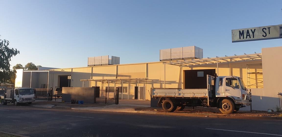 Truck Parked in Front of Building With Steel Awning Structure — Our Completed Projects in Townsville, QLD
