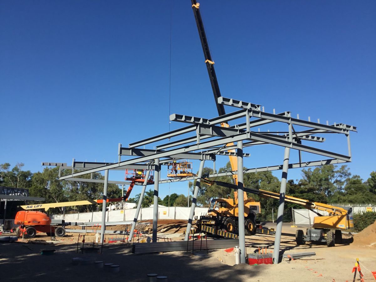 Structural Steel Frame Being Erected Via Crane — Our Completed Projects in Townsville, QLD