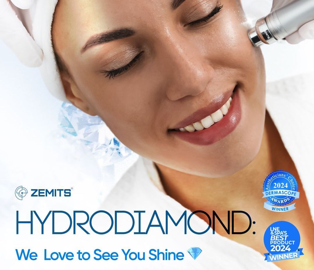 A woman is smiling while getting a hydro diamond treatment