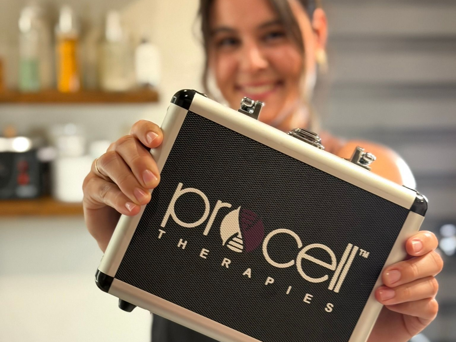 Woman holding a black and silver case