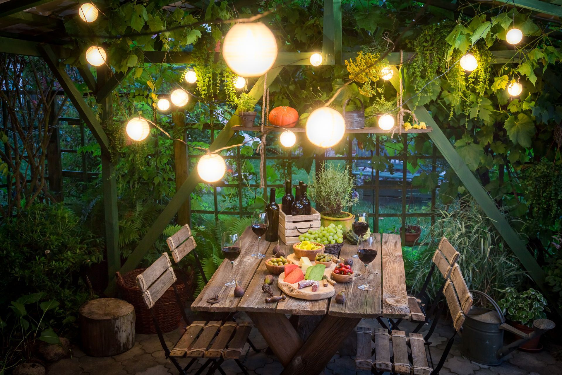 Preparation for dinner with cheese, red wine in the evening with a beautiful lights for a romantic ambiance