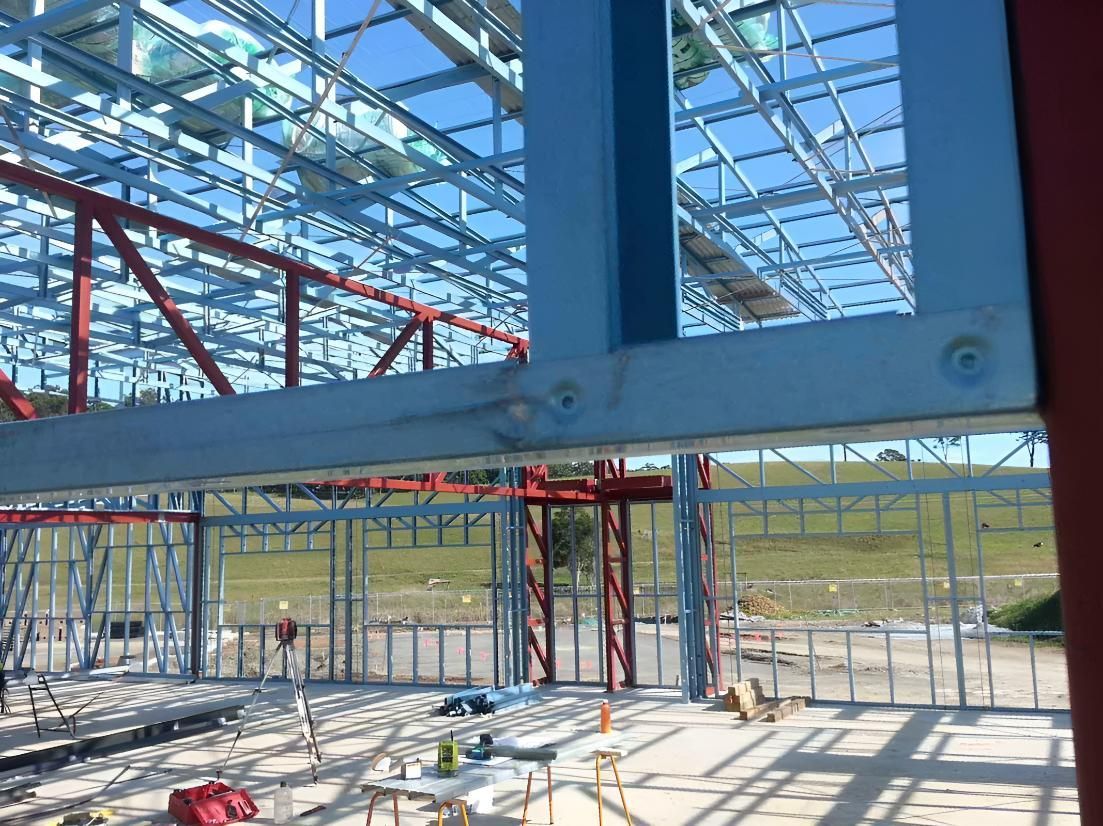 A Building is Being Built With a Lot of Steel Beams — Aspex Construction - Lou Pieren In Port Macquarie, NSW