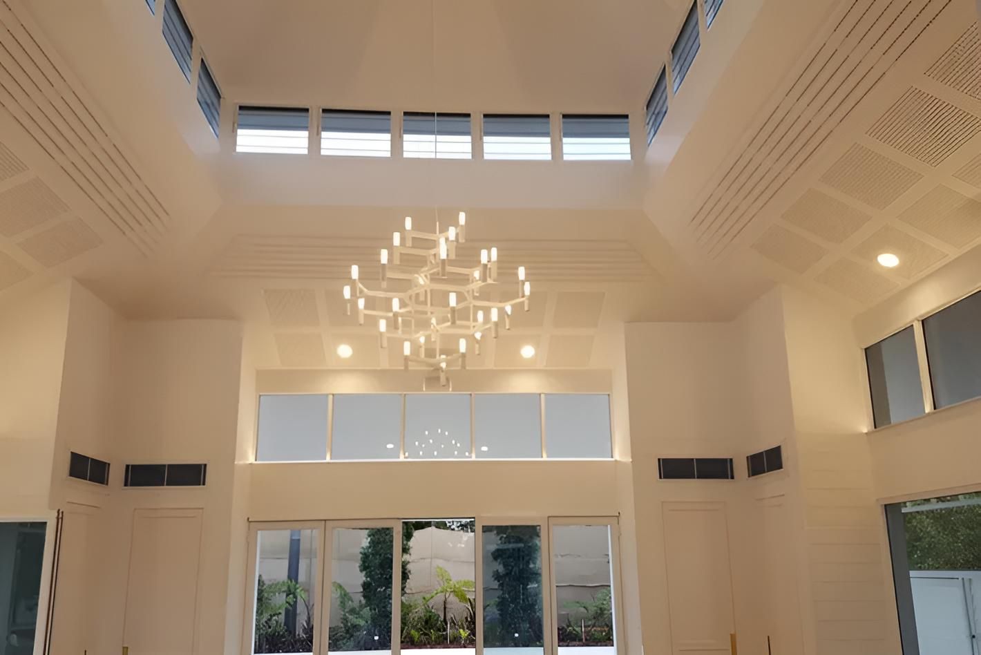 A Large Room With a Chandelier Hanging From the Ceiling — Aspex Construction - Lou Pieren In Port Macquarie, NSW