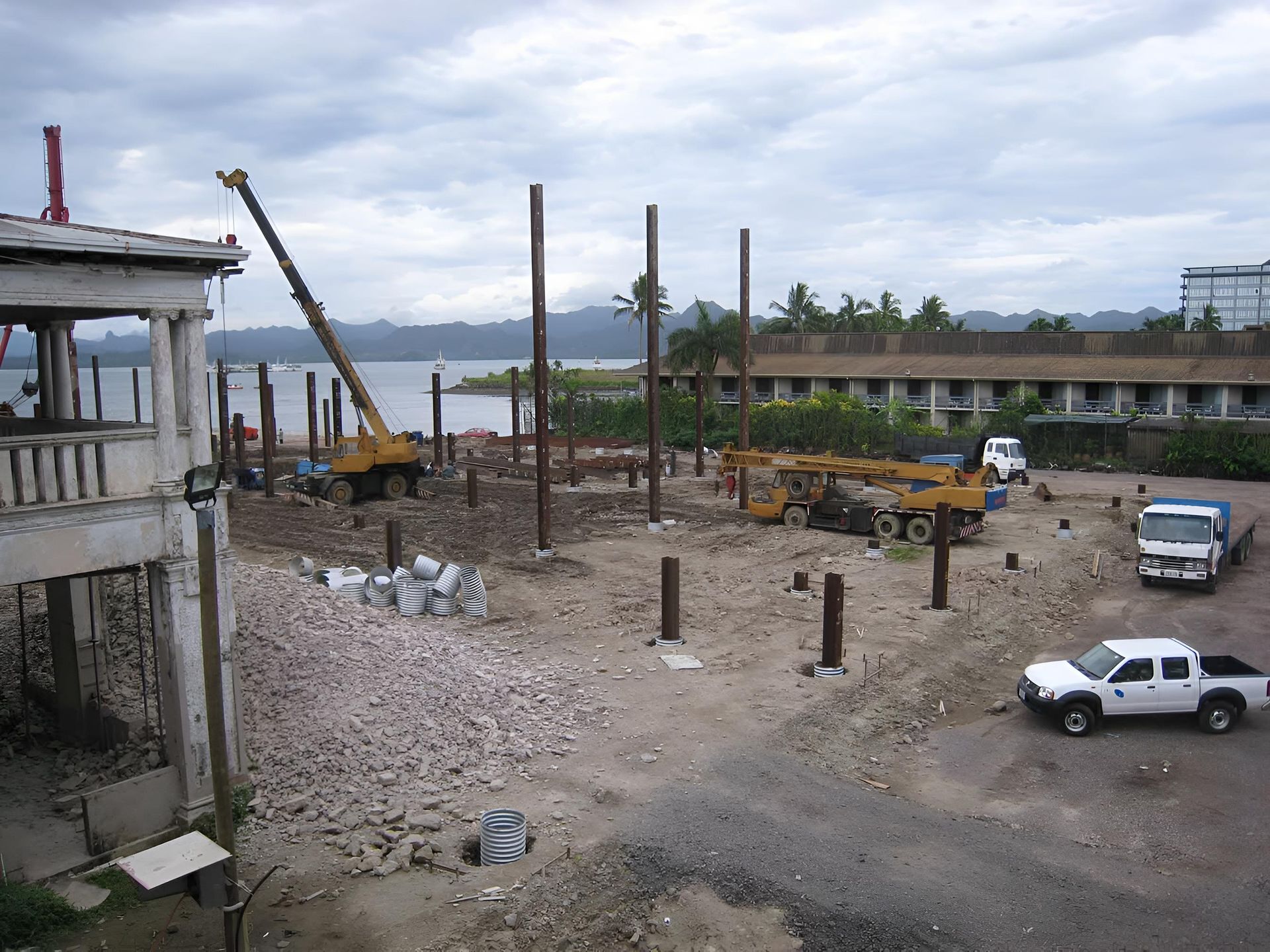 A White Truck is Parked in Front of a Construction Site — Aspex Construction - Lou Pieren In Lake Cathie, NSW