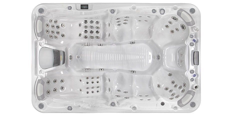 Overhead view of a white hot tub with multiple seating areas and jet nozzles.