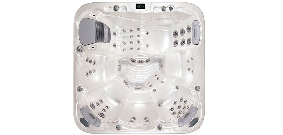 Top-down view of a clear, square hot tub with various jets and seating areas.
