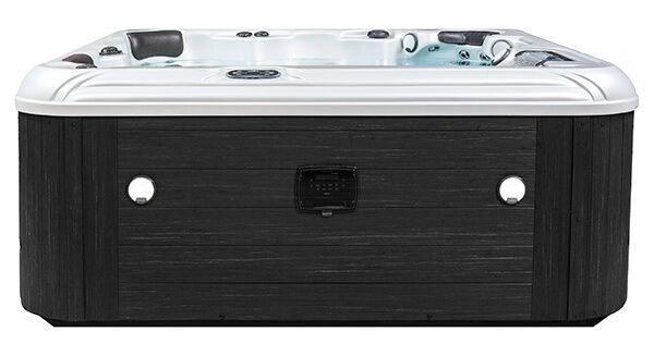 A modern, rectangular hot tub with a dark wood-paneled exterior and a white acrylic interior, viewed from the front.