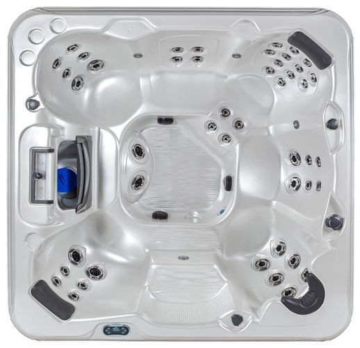 Top-down view of a white, square hot tub with five molded seats, built-in headrests, and numerous water jets.