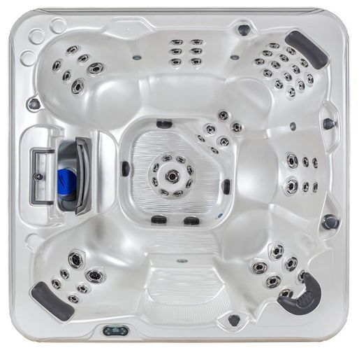An empty, square, white hot tub viewed from directly above, featuring built-in seating, headrests, and numerous water jets.