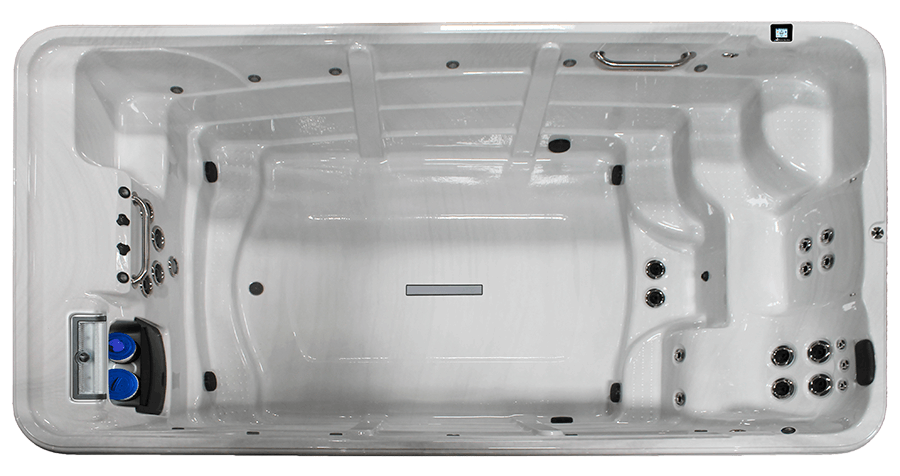 Top-down view of a white, rectangular swim spa with jet configurations at both ends and a centered floor drain.
