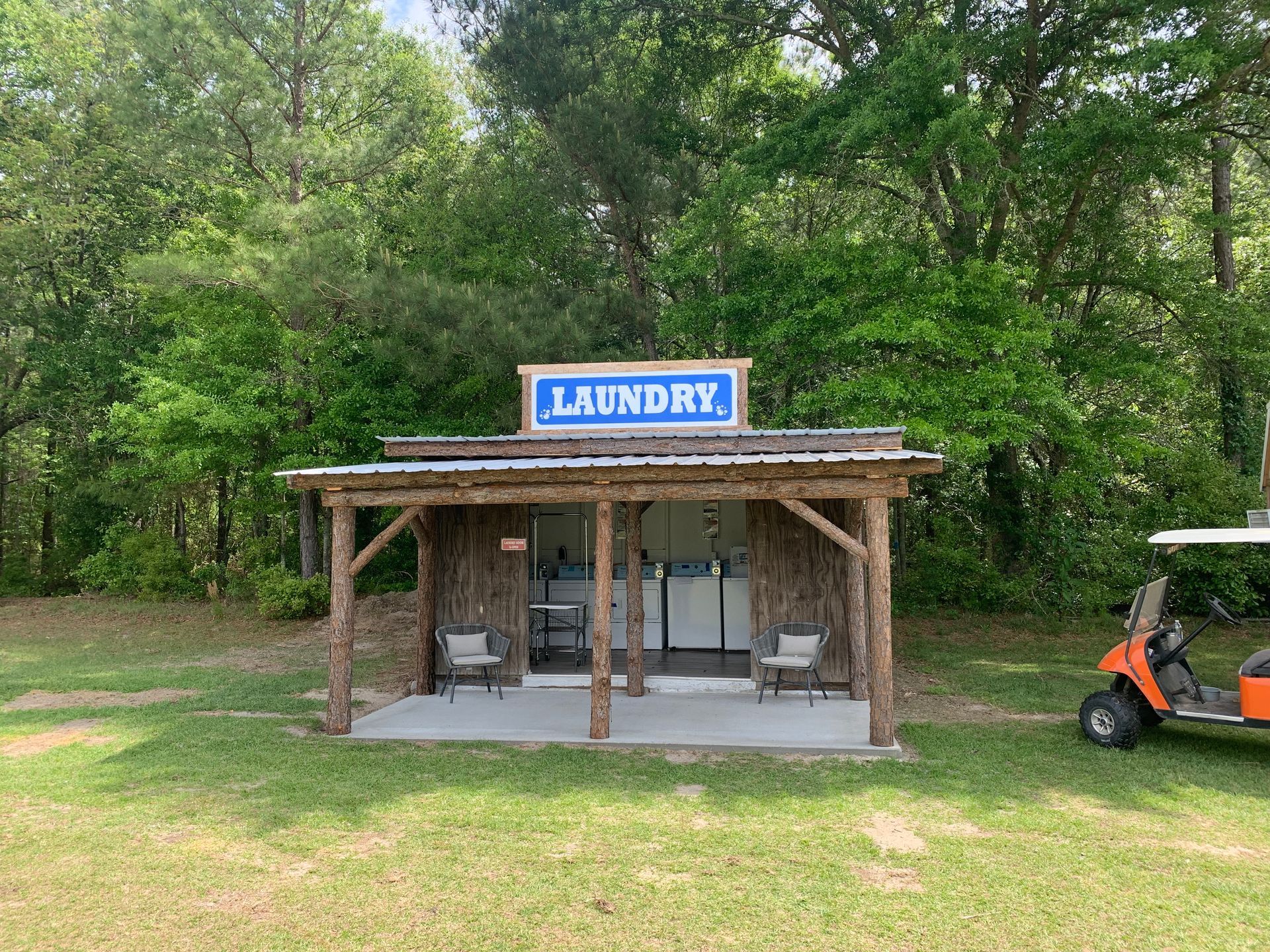 A washer and dryer are sitting next to each other on a white background.