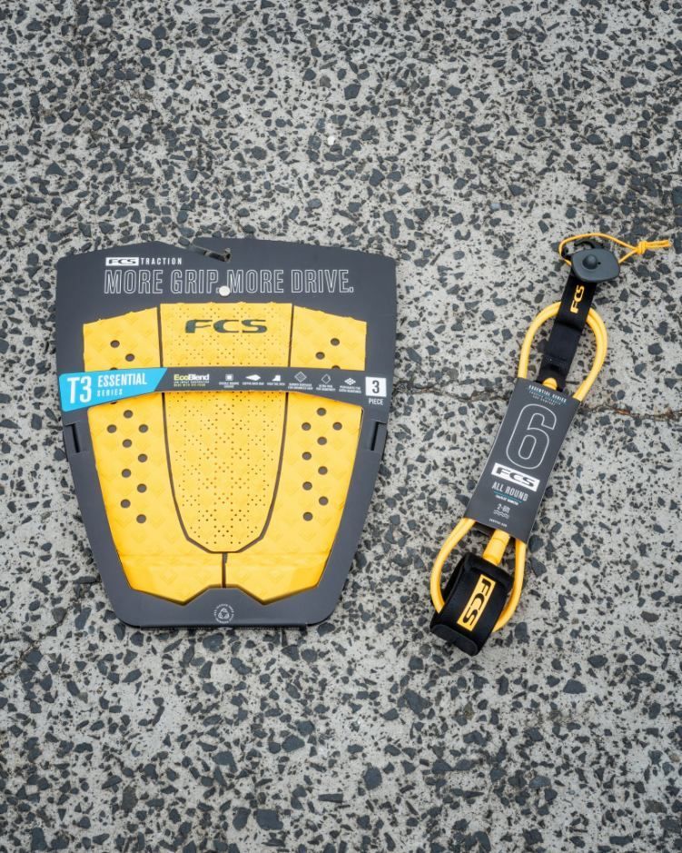 A Yellow Fcs Surfboard and A Yellow Leash — Slimes Boardstore in Erina, NSW