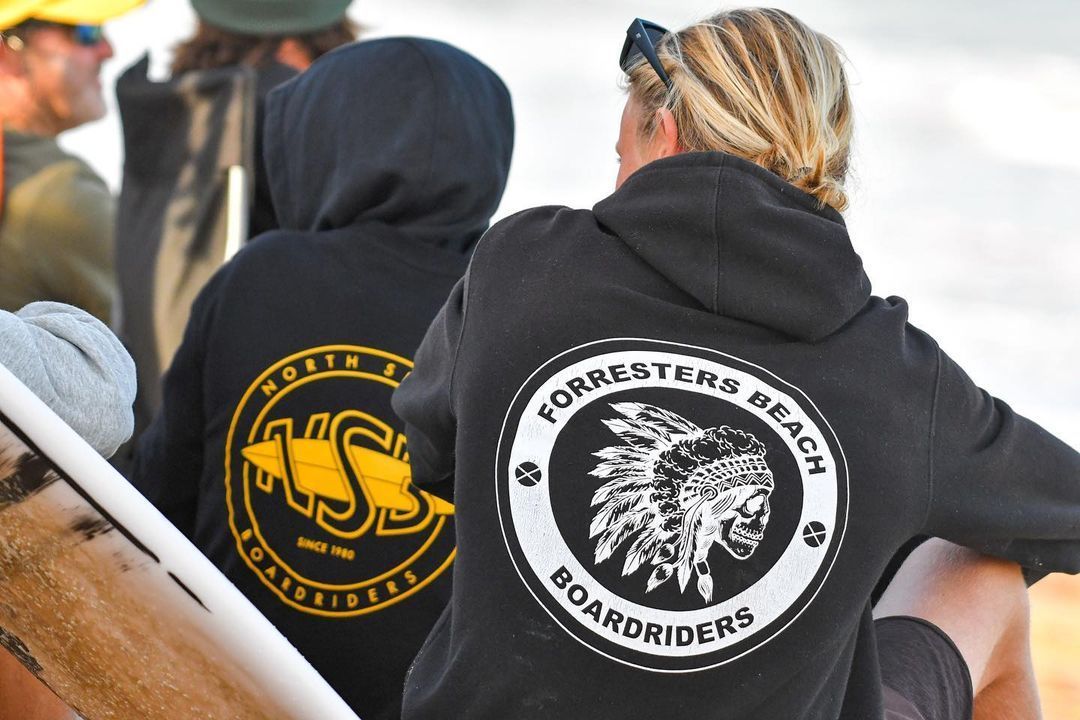 Surfer Gracefully Rides a Wave While Stylishly Dabbing — Slimes Boardstore in Erina, NSW