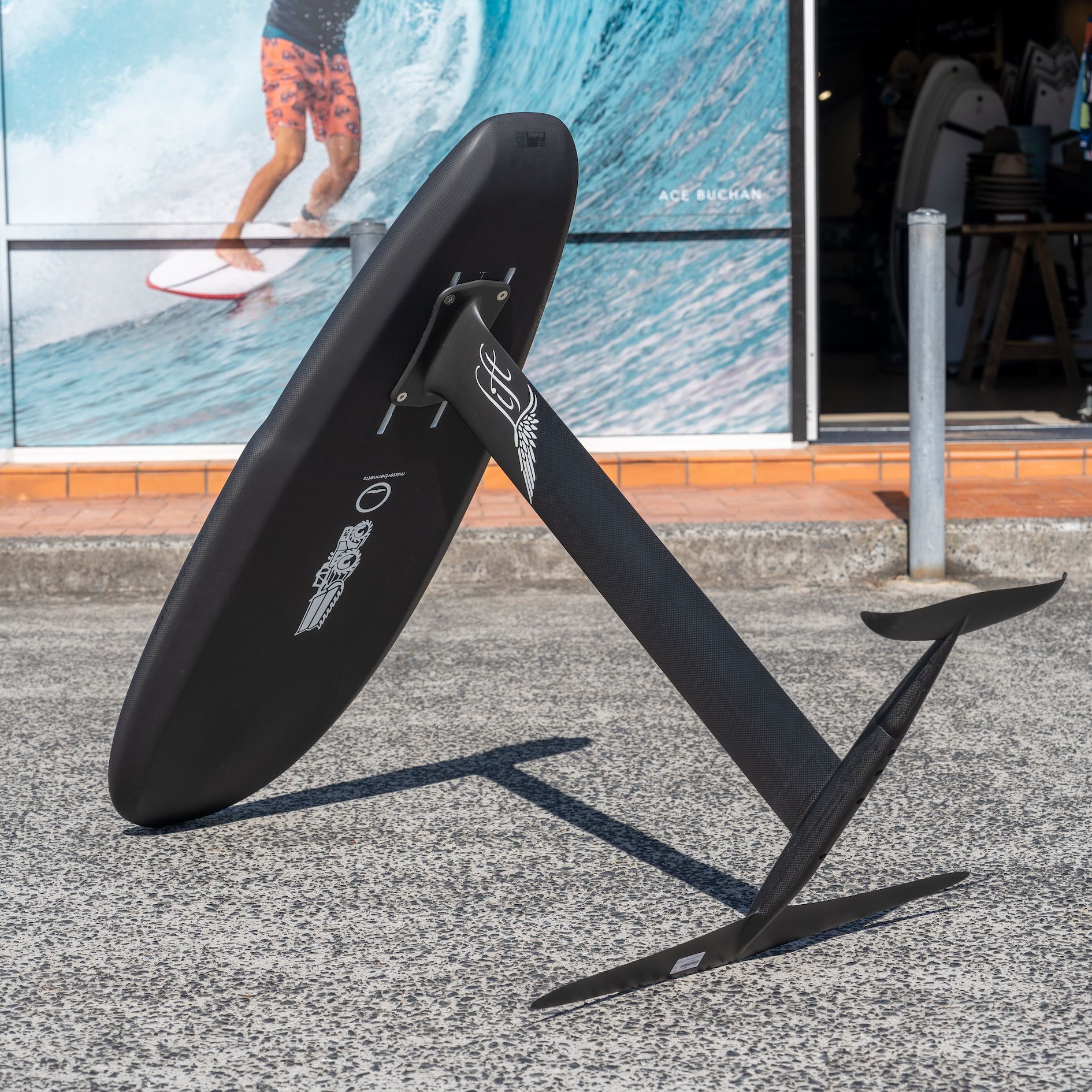 Man Admiring Surfboards Displayed Outside the Store — Slimes Boardstore in Erina, NSW