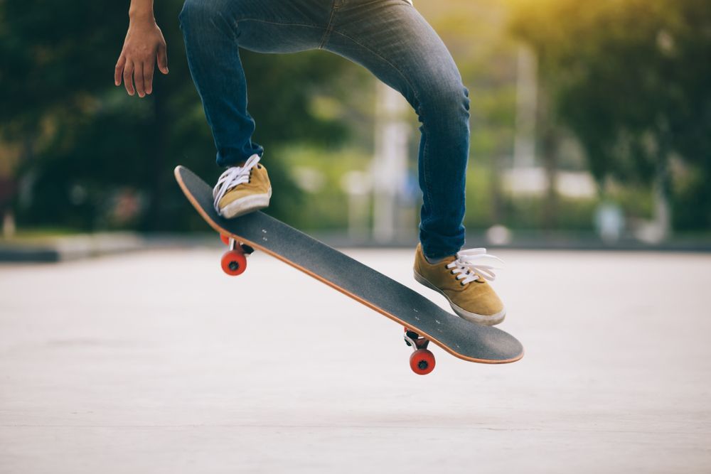 Skateboarder skillfully rides on a parking lot — Surf Shop in Erina, NSW