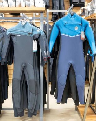 Wetsuits Hanging Up in the Surf Shop — Slimes Boardstore in Erina, NSW