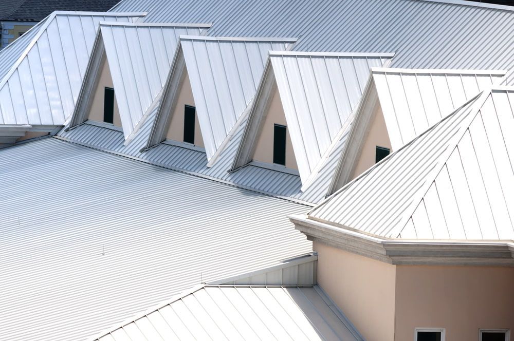 A Row of White Metal Roofs — Woodger's Metal Roofing Specialists Pty Ltd in Nambucca Heads, NSW