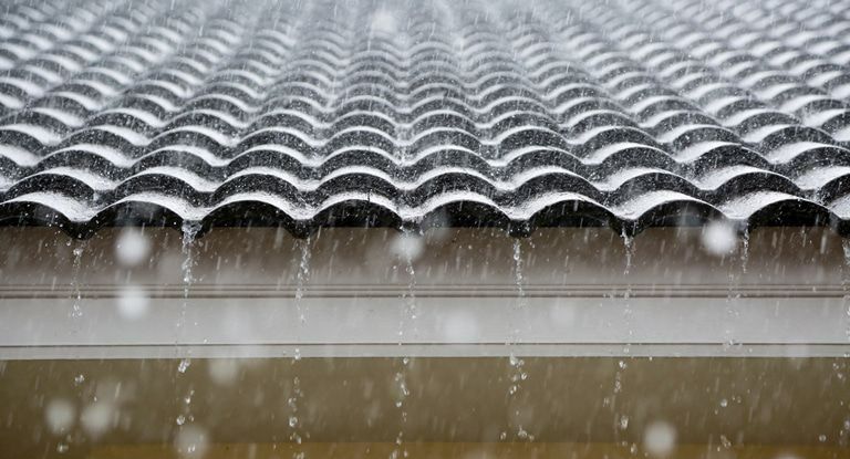 A Close Up of a Roof With Rain Falling on It.  — Woodger's Metal Roofing Specialists Pty Ltd in Kempsey, NSW