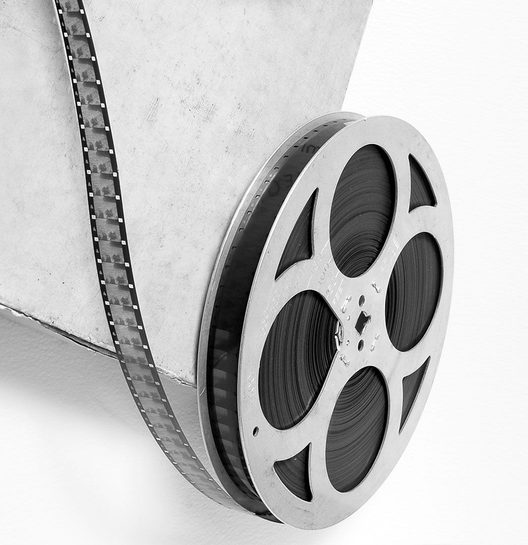 A woman is sitting at a desk with a computer