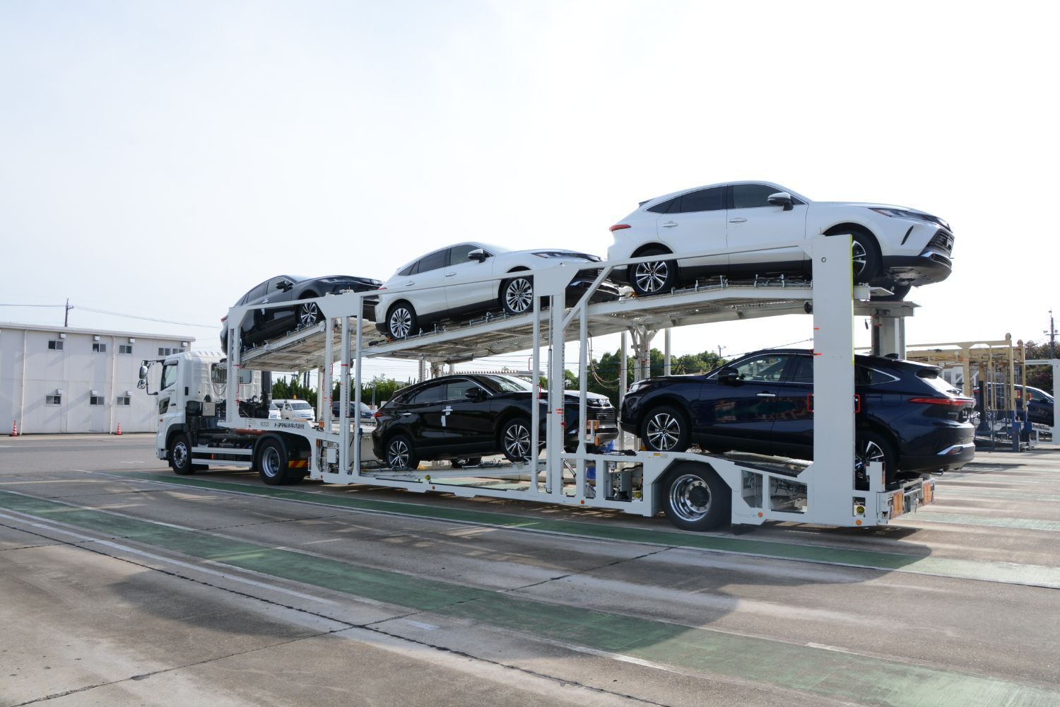 Electric cars on truck, in transit to  Car Dealerships 