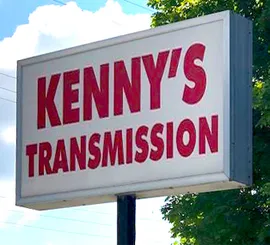 A sign that says kenny 's transmission on it