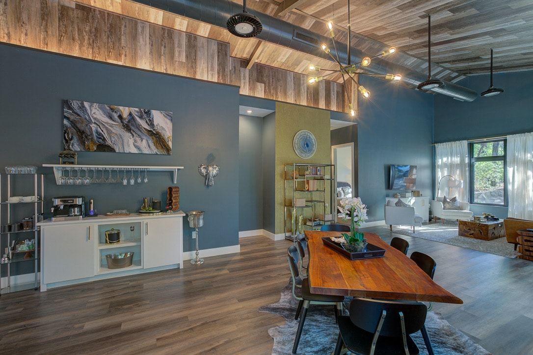 There is a large wooden table in the middle of the room.