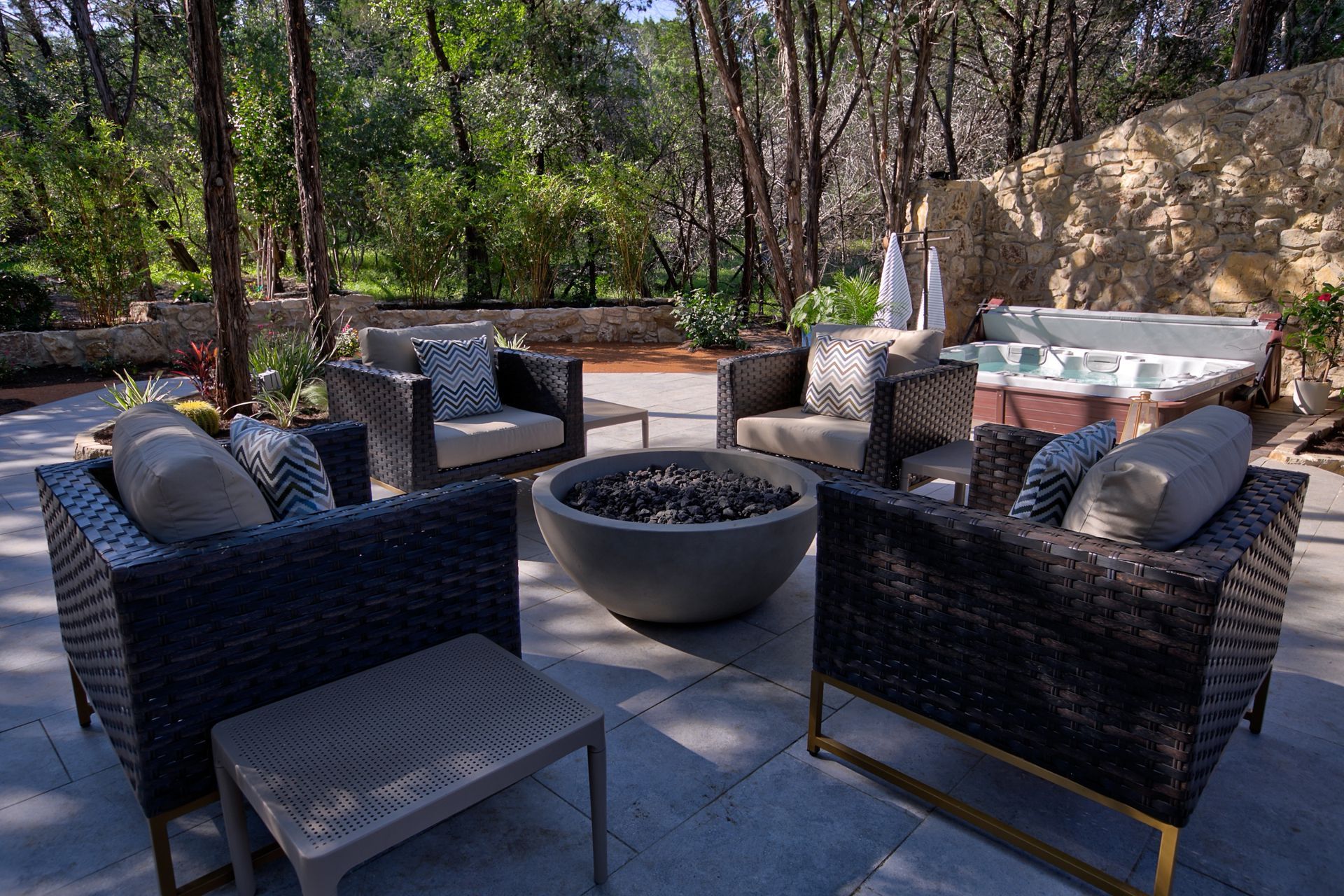 There is a fire pit in the middle of the patio.