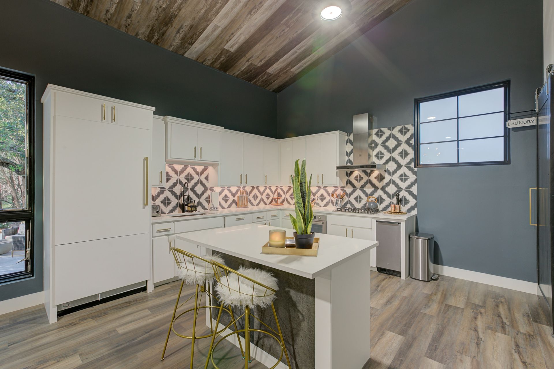 A kitchen with a large island in the middle of the room.